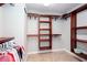 Walk-in closet features custom shelving and ample space for storage at 5529 Camden Lake Pointe Nw, Acworth, GA 30101