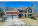 Attractive brick home featuring a two-car garage and a lush lawn at 5529 Camden Lake Pointe Nw, Acworth, GA 30101