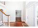 Bright foyer with hardwood floors leading to a staircase and views of adjacent spaces at 5529 Camden Lake Pointe Nw, Acworth, GA 30101