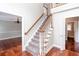 Grand foyer with hardwood floors, staircase, and access to multiple rooms at 5529 Camden Lake Pointe Nw, Acworth, GA 30101