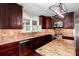 Open kitchen features granite countertops, stainless steel appliances, and a tile backsplash at 5529 Camden Lake Pointe Nw, Acworth, GA 30101
