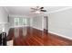 Spacious living area with hardwood floors, ample natural light, and a cozy fireplace at 5529 Camden Lake Pointe Nw, Acworth, GA 30101