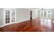 Expansive living room featuring hardwood floors, bright windows, and neutral walls at 5529 Camden Lake Pointe Nw, Acworth, GA 30101