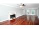 Bright living room featuring hardwood floors, a fireplace, and neutral tones at 5529 Camden Lake Pointe Nw, Acworth, GA 30101