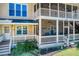 Multi-level screened porch, offering outdoor seating and picturesque views of the backyard at 5529 Camden Lake Pointe Nw, Acworth, GA 30101