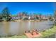 Scenic water view showcasing waterfront homes and a private wooden dock at 5529 Camden Lake Pointe Nw, Acworth, GA 30101