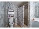 Cozy bathroom featuring a shower/tub combo with marble style walls, and ample storage space at 7130 Oakley Ct, Union City, GA 30291