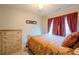 Comfortable bedroom with natural light, featuring a plush bed and matching dresser at 7130 Oakley Ct, Union City, GA 30291