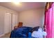 Cozy bedroom features a comfortable bed with closet, offering functional relaxation at 7130 Oakley Ct, Union City, GA 30291
