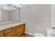 Bathroom with wood cabinet vanity, ample countertop space, and essential fixtures, designed for functionality at 9180 Shiloh Dr, Villa Rica, GA 30180