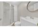 Bright bathroom with modern shower, sink, cabinet, toilet, and wood-look floors, designed for comfort at 9180 Shiloh Dr, Villa Rica, GA 30180