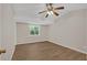 Spacious bedroom featuring a ceiling fan, window with a view, and wood-look flooring at 9180 Shiloh Dr, Villa Rica, GA 30180