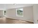 Bright bedroom filled with natural light from large windows overlooking the landscape at 9180 Shiloh Dr, Villa Rica, GA 30180