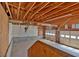 Spacious garage with exposed wood beams and two-car capacity, offering ample storage and parking at 9180 Shiloh Dr, Villa Rica, GA 30180
