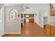 Open concept kitchen with wood floors and white appliances, ready for your personal touch at 9180 Shiloh Dr, Villa Rica, GA 30180