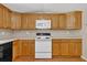 Bright kitchen showcasing stainless steel appliances and stylish wood cabinetry at 9180 Shiloh Dr, Villa Rica, GA 30180