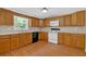Spacious kitchen featuring wood cabinets, ample countertop space, and modern appliances at 9180 Shiloh Dr, Villa Rica, GA 30180