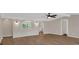 Bright living room with hardwood floors, stylish archways, and modern ceiling fan at 9180 Shiloh Dr, Villa Rica, GA 30180