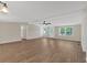 Inviting living room featuring abundant natural light and modern wood-look flooring at 9180 Shiloh Dr, Villa Rica, GA 30180