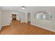 The open floor plan connects living areas featuring modern wood-look floors and neutral walls at 9180 Shiloh Dr, Villa Rica, GA 30180