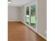 Light-filled room showcases stylish flooring and a seamless transition to the outdoors via glass doors at 9180 Shiloh Dr, Villa Rica, GA 30180