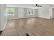 Bright living space with a ceiling fan, windows, and new wood-look flooring at 9180 Shiloh Dr, Villa Rica, GA 30180