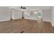 Large living area with modern ceiling fan, archways, and durable wood-look flooring at 9180 Shiloh Dr, Villa Rica, GA 30180