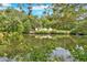 Scenic view of a tranquil pond surrounded by lush greenery, offering a peaceful retreat at 9180 Shiloh Dr, Villa Rica, GA 30180