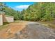 Large yard with a gravel driveway and plenty of parking space at 9180 Shiloh Dr, Villa Rica, GA 30180