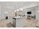 Bright kitchen with island open to the living room area and access to the backyard at 114 Green Tree Ct, Dacula, GA 30019