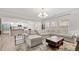 Spacious living room with large sectional sofa, stylish rug, and ample natural light at 114 Green Tree Ct, Dacula, GA 30019
