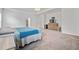 Spacious main bedroom featuring a tray ceiling, carpet, and an ensuite bath at 114 Green Tree Ct, Dacula, GA 30019