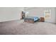 Spacious main bedroom with carpet and a tray ceiling providing natural light at 114 Green Tree Ct, Dacula, GA 30019
