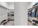 Walk-in closet featuring built-in shelving and ample space for storage at 114 Green Tree Ct, Dacula, GA 30019
