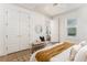 Bright bedroom featuring white walls, large closets, and modern decor at 1453 Hartford Sw Ave, Atlanta, GA 30310