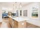 Bright kitchen with stainless steel appliances, light wood island, and pendant lighting at 1453 Hartford Sw Ave, Atlanta, GA 30310
