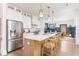 Modern kitchen featuring white cabinets, stainless steel appliances, and an island with seating at 1453 Hartford Sw Ave, Atlanta, GA 30310