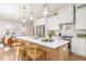 Bright, open kitchen featuring a large island with counter seating and modern stainless steel appliances at 1453 Hartford Sw Ave, Atlanta, GA 30310
