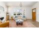 Bright living room featuring large windows, hardwood floors, and stylish furniture at 1453 Hartford Sw Ave, Atlanta, GA 30310