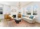 Bright living room with a decorative fireplace and large windows at 1453 Hartford Sw Ave, Atlanta, GA 30310