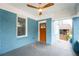 Inviting front porch featuring painted brick and a stylish ceiling fan at 1453 Hartford Sw Ave, Atlanta, GA 30310