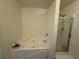 Bathroom featuring a soaking tub and a separate shower with glass door at 3191 Creston Park Ct, Duluth, GA 30096