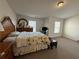 Bedroom with neutral carpet, wood furniture, and two windows at 3191 Creston Park Ct, Duluth, GA 30096