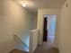 Hallway leading to bedroom with dresser, carpet, and window with blinds at 3191 Creston Park Ct, Duluth, GA 30096