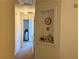 Hallway with an alcove, neutral paint and carpet, and doorway leading into another room at 3191 Creston Park Ct, Duluth, GA 30096