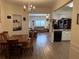 Open-concept living area with hardwood floors, seamlessly connecting the dining and kitchen spaces at 3191 Creston Park Ct, Duluth, GA 30096