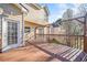 Spacious wooden deck with trellised covering on the back of the house at 1039 Ashfern Walk, Woodstock, GA 30189