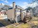 Back exterior view of a two-story home with a spacious deck, well-maintained lawn and mature trees at 1039 Ashfern Walk, Woodstock, GA 30189