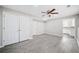 Basement room with luxury vinyl plank flooring and a view to the kitchen at 1039 Ashfern Walk, Woodstock, GA 30189