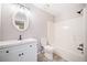 Bathroom features a shower-tub combination with a dark shower head and updated vanity at 1039 Ashfern Walk, Woodstock, GA 30189